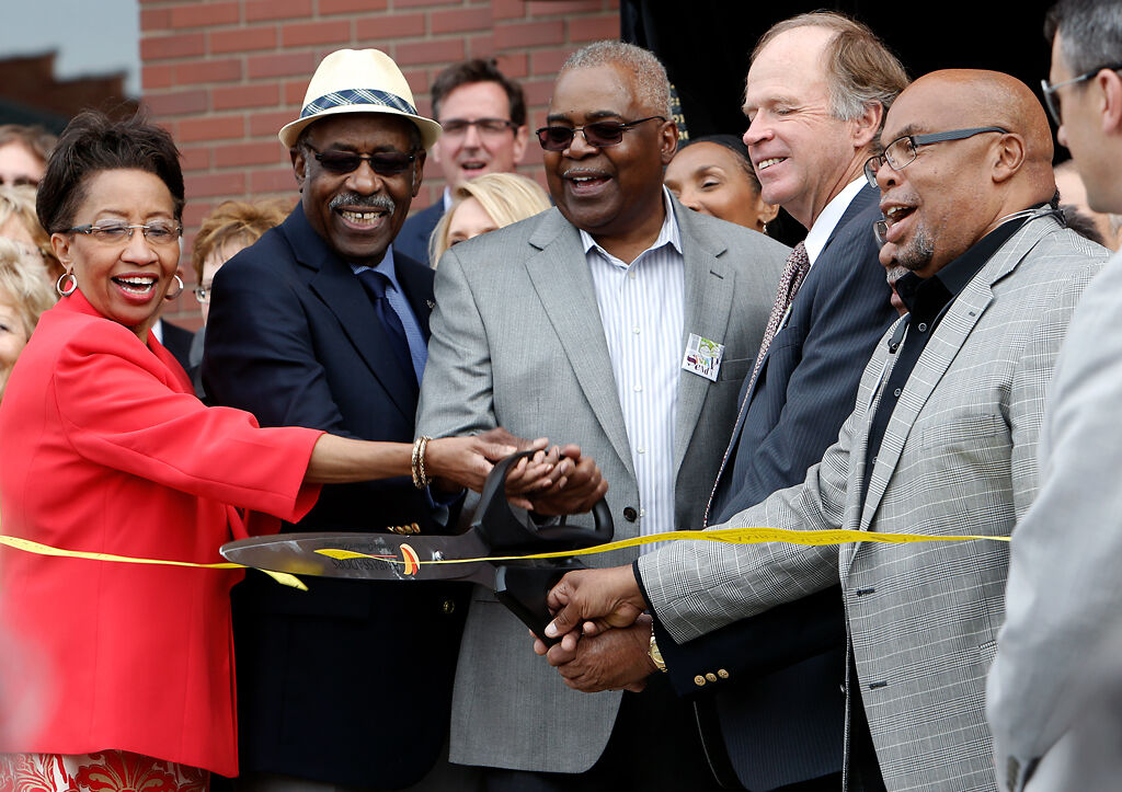 Sharp End Heritage Committee members cut a ribbon